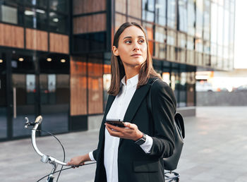 Young businesswoman using mobile phone