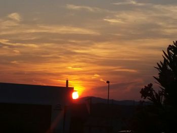 Silhouette of built structure at sunset