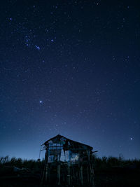 Low angle view of building against sky at night