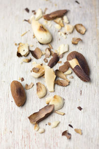 Close-up of crushed roasted almonds on table