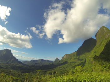 Scenic view of mountains against cloudy sky