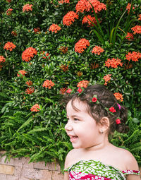 Portrait of girl with red flowers