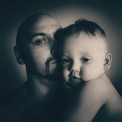 Portrait of father with baby