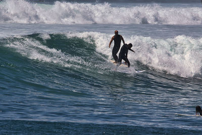 Full length of man surfing in sea