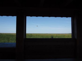 Scenic view of landscape seen through window