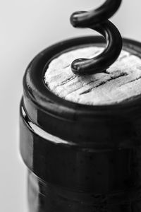 Close-up of metal object over white background