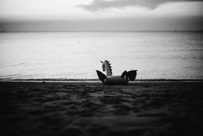 Inflatable raft on shore at beach