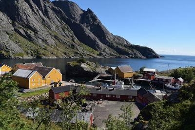 Scenic view of sea and buildings against sky