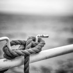 Close-up of rope tied to bollard