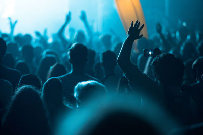 Crowd during music concert at night