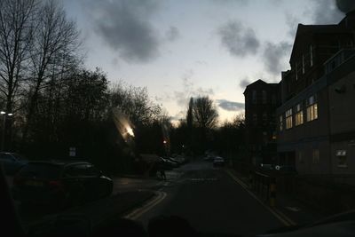 Cars on road at sunset