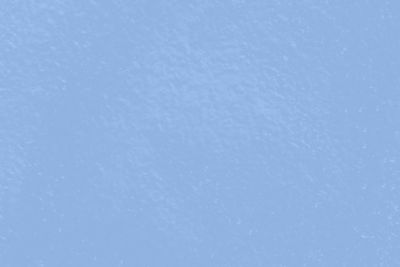 Full frame shot of snow against blue sky