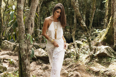 Young woman walking in forest
