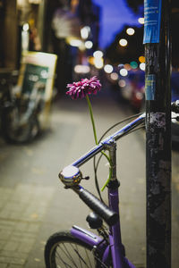 Close-up of bicycle on road at night