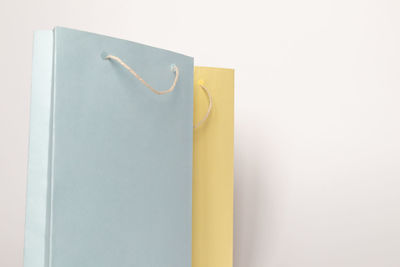 Close-up of paper hanging against white background