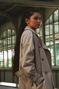 Young woman standing on the platform.