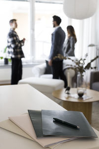 Agreement files with pen on table at home