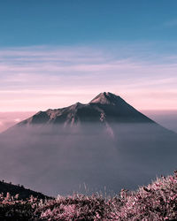 View of volcanic landscape against sky during sunset