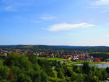 Panoramic view of trees and buildings against sky