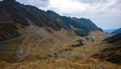 Scenic view of mountain road against sky