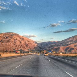 Country road leading towards mountains