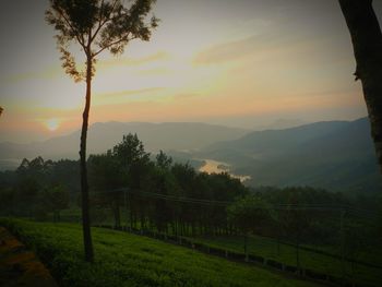 Scenic view of landscape against sky during sunset