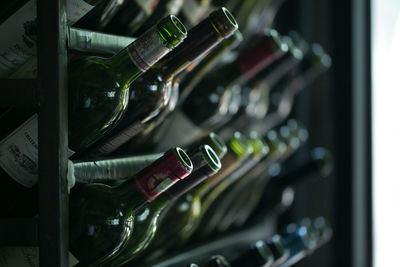 High angle view of wine bottles in rack