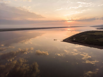 Reflection of clouds in sky during sunset