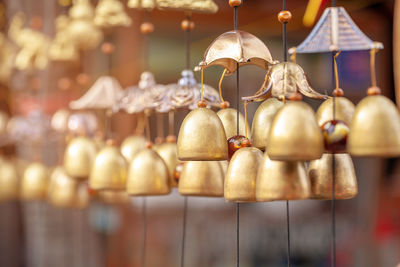 Close-up of wind chimes hanging for sale at market