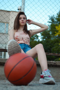 Young woman playing basketball