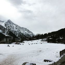 Scenic view of snow covered mountain against sky