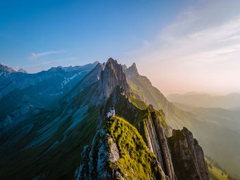 Panoramic view of snowcapped mountains against sky