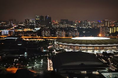 High angle view of illuminated buildings in city at night