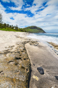 Scenic view of beach against sky