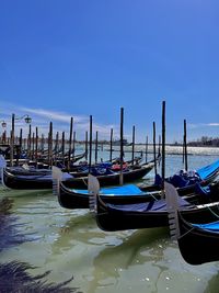 Boats moored at harbor