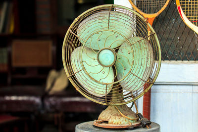 Close-up of electric fan on table