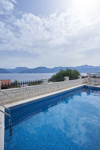 Scenic view of swimming pool against sky