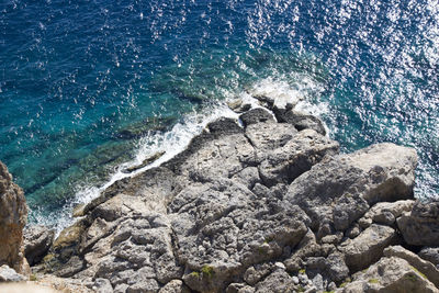 High angle view of rocks on shore