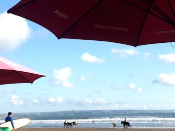 Beach umbrella against the sky