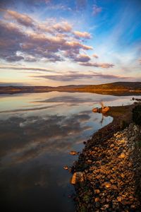 Scenic view of sea against sky at sunset