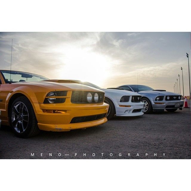 transportation, car, land vehicle, mode of transport, transfer print, sky, auto post production filter, street, cloud - sky, road, yellow, sunset, stationary, cloud, travel, outdoors, vehicle, on the move, no people, cloudy