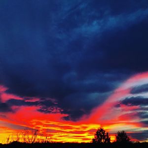 Low angle view of dramatic sky during sunset