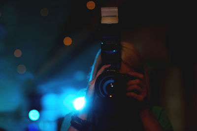 Woman photographing with camera