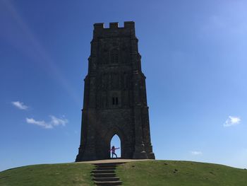 Low angle view of old ruined building against sky