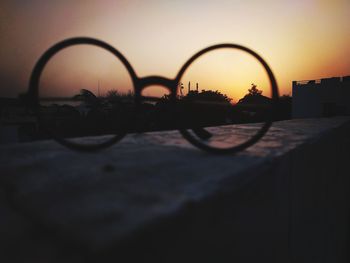 Close-up of silhouette against clear sky at sunset