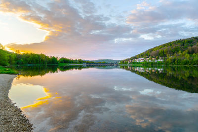 Scenic view of lake against sky during sunset