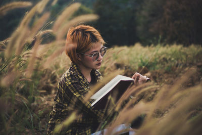 Young woman using mobile phone outdoors