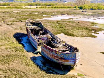 High angle view of abandoned boat wrecked on shore