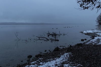 Scenic view of sea against sky during winter