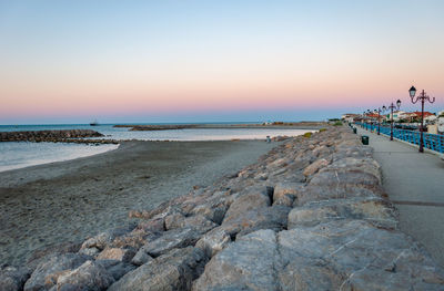 Scenic view of sea against clear sky during sunset